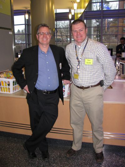 Scott Ringlein, founder of EAG of Michigan, and Byron Myer, Mott Community Relations, with some of the toys EAG donated to Mott.