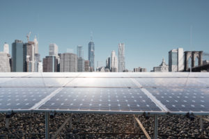 solar panels with modern city new york